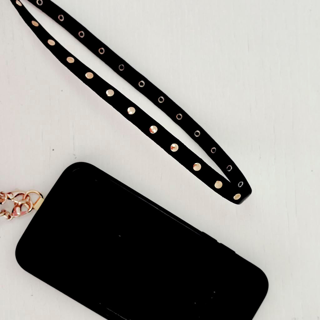 Colgador móvil negro tachas oro